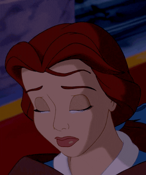 Disney gif. Belle in the cartoon Beauty and the Beast looks down with her eyes closed as a teardrop falls down her cheek.