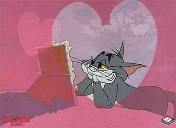 Cartoon gif. Jerry from Tom and Jerry lounging and gazing at a picture frame adoringly, as pink hearts surround him.